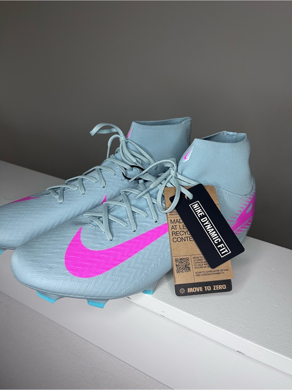 Nike Men’s Light Blue Soccer Cleats with Pink Swoosh
